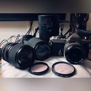 Nikon Silver and Black Film Camera with Lenses